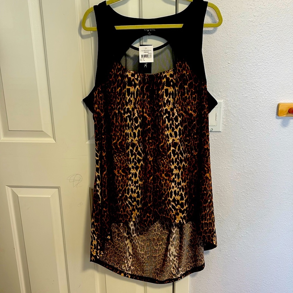 I’m offering a brand new Nordstrom animal-print short-sleeve top.